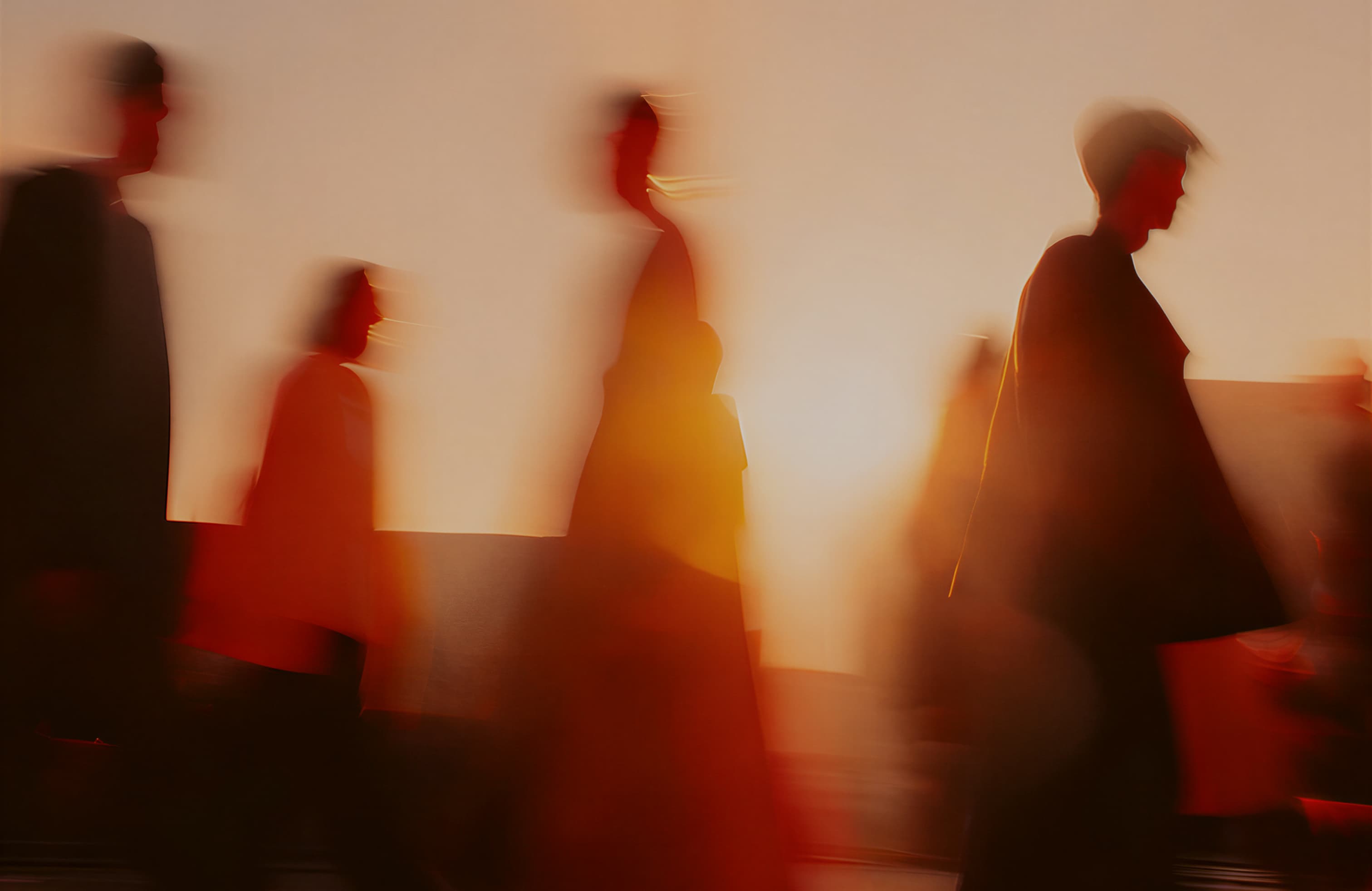 People crossing the street near 80-85 TCR at sunset